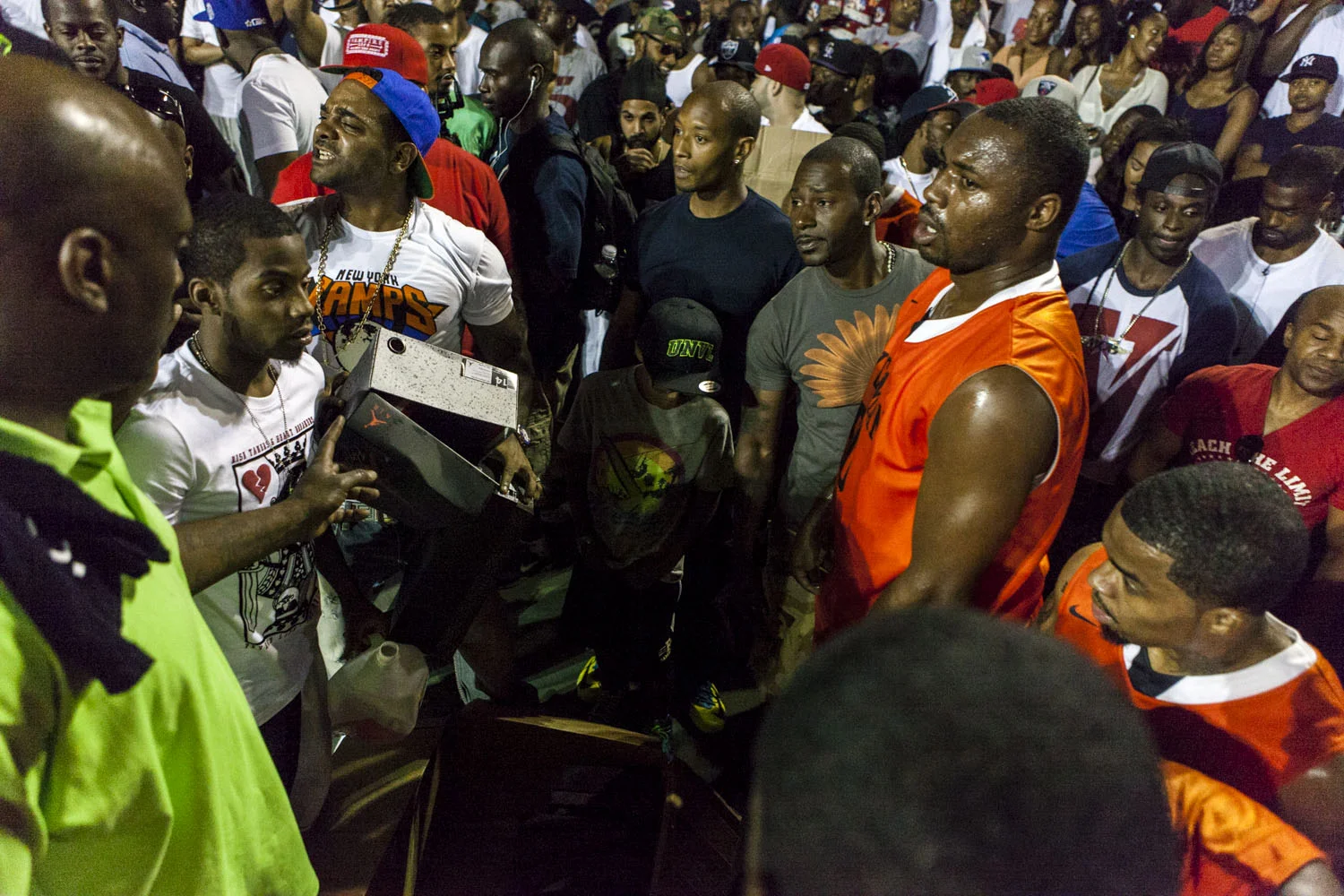 Jim Jones made time to give away several pair of Air Jordan kicks to some lucky fans during the game. 