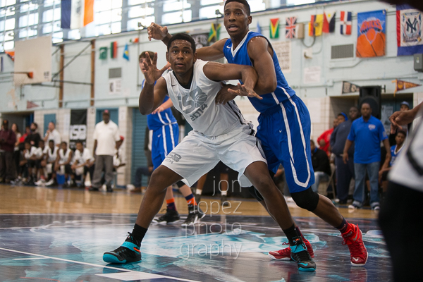 Players battle for position on an inbounds play. 