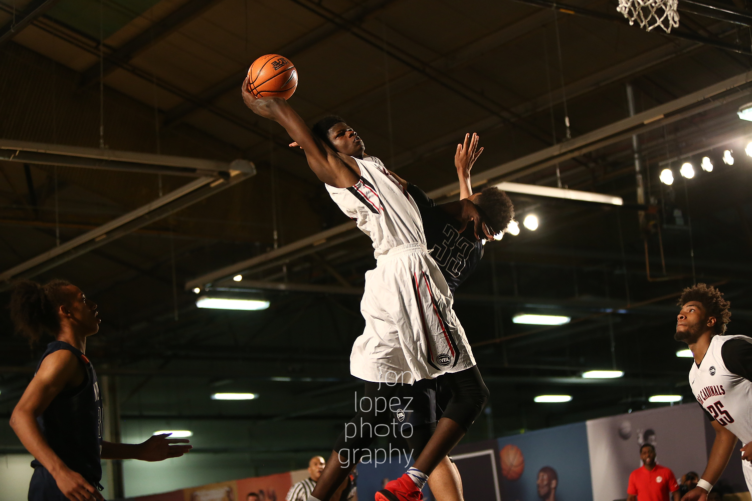 Mohamed Bamba #11 of the PSA Cardinals (NYC) attacks the basket. 