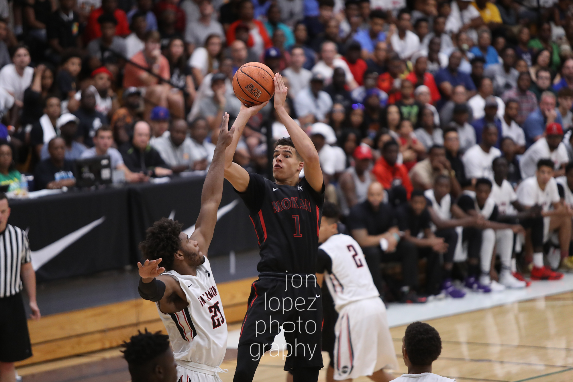 Mokan Elite's Michael Porter was possibly the EYBL's most complete player. Here he pulls up for a jumper over the outstretched hands of the defense en route to winning Peach Jam 2016. 