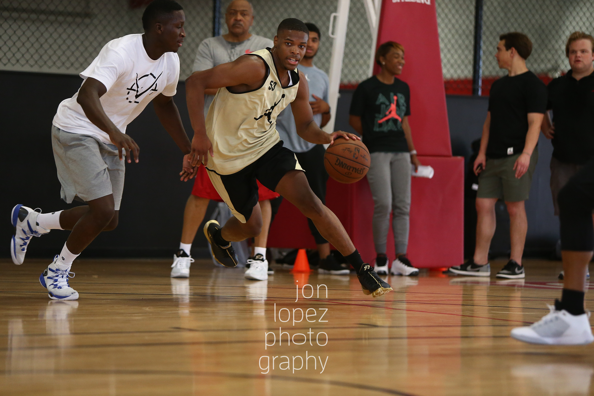 With CP3 nursing a hand injury, Victor Oladipo took on the challenge of giving the top point guards in America some hands on experience with NBA talent. Here Dennis Smith dribbles while being defended by the Oklahoma City guard. 