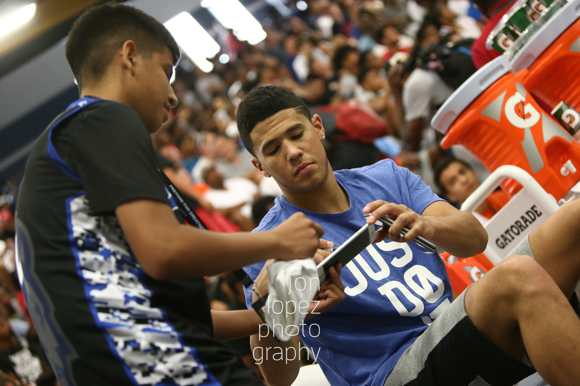  LAS VEGAS, NV. JULY 21, 2016. The Eight. Devin Booker signs autograph. (Mandatory photo credit: Jon Lopez/Nike).  