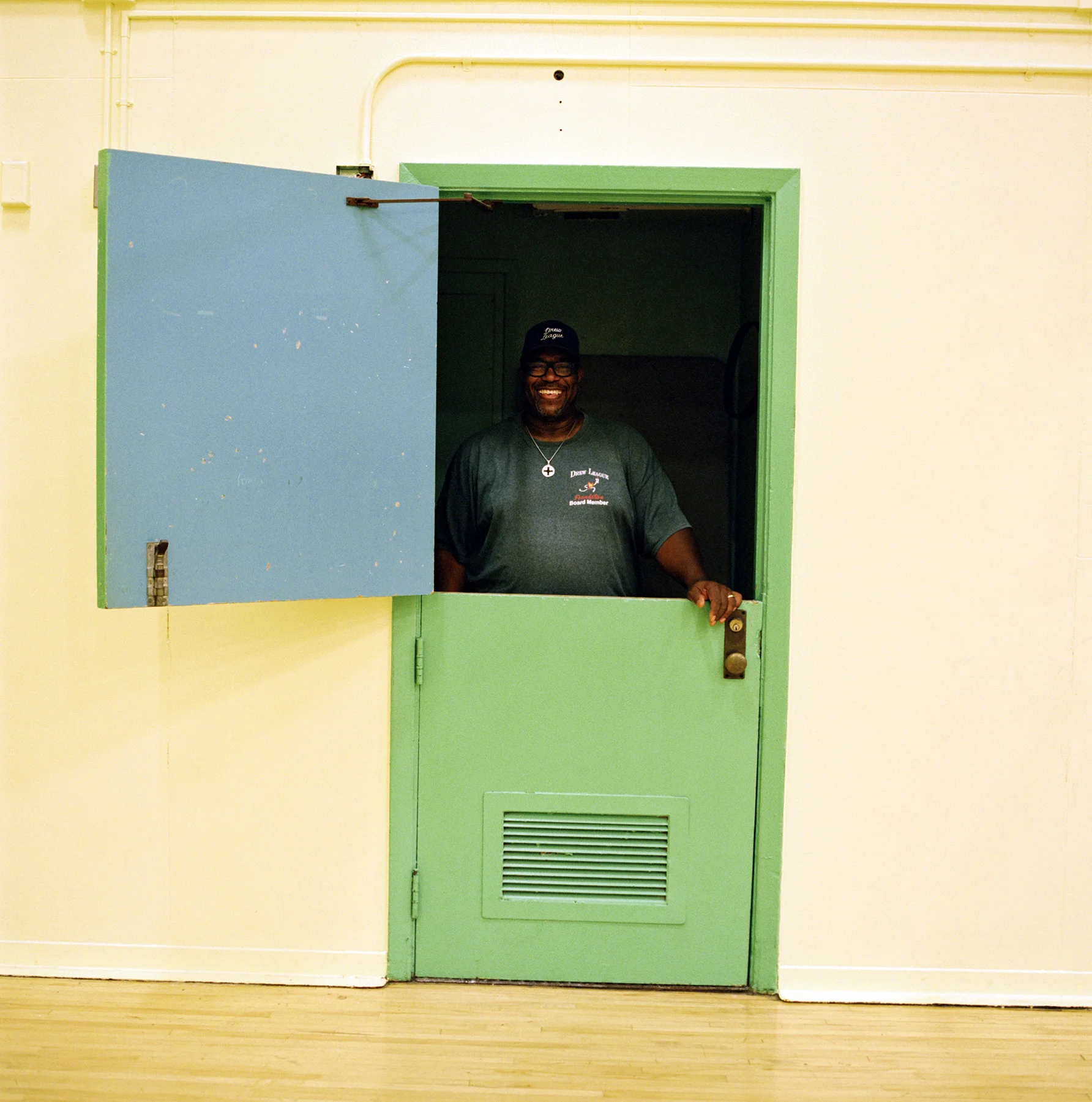 Drew League commissioner Mr. Smiley gave me the honor of showing me around some of the historic Drew League venues. He told me about the impact the league has had on the community and how he used to sign teams in, keep score, and sell snacks to keep the league alive. Here he is in the closet just a few feet from the sideline behind where the team benches used to live and from where he would sell refreshments to raise money for the league.