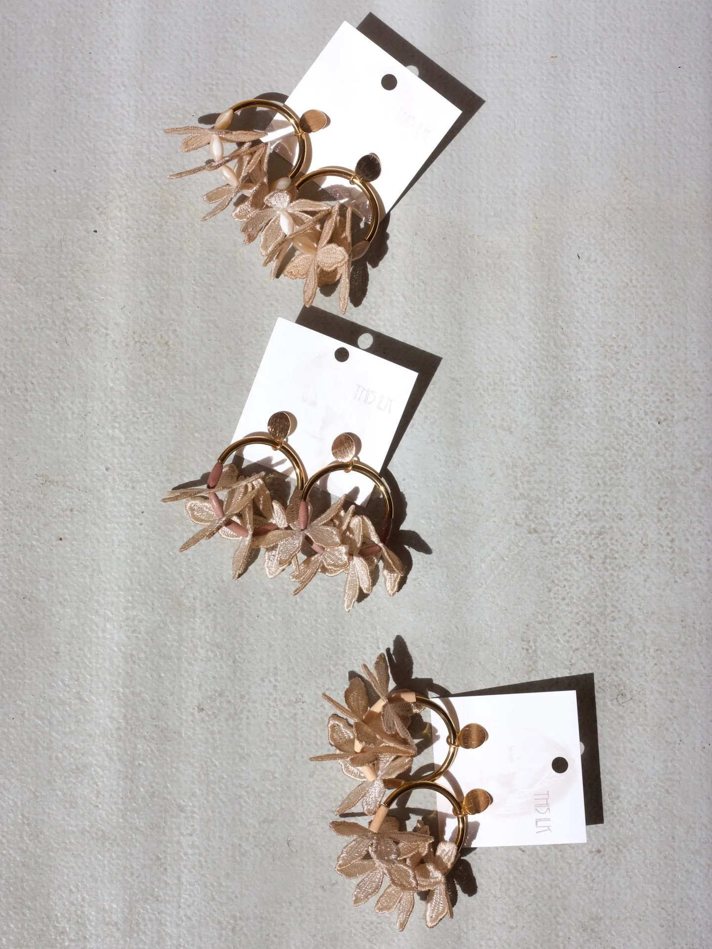 After spending an unreasonable amount of time searching for more of the perfect little vintage wooden Czech beads that made up or Kui earrings, we have given up hope and are working to replace them for different options. 

We have pinkish tone bead f