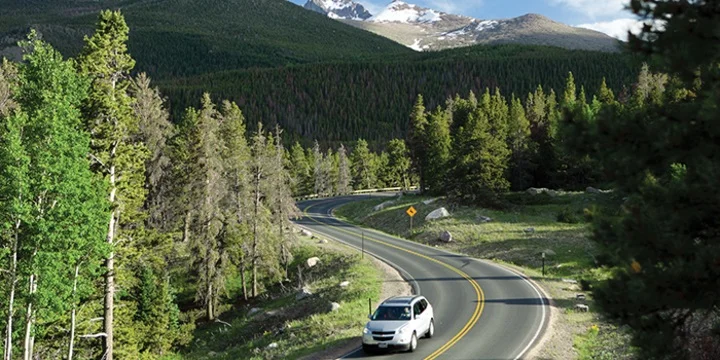 It goes up to 10,000 feet and then winds down pretty steeply into Denver. Mini loved this road!