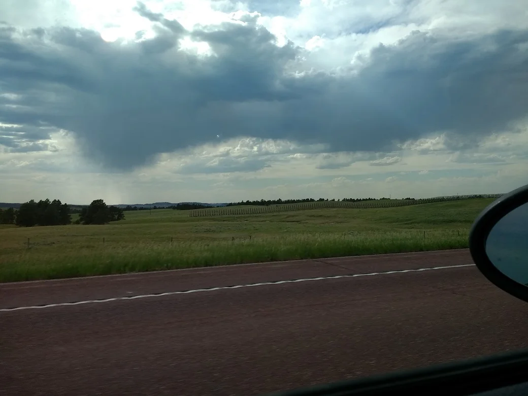 See that weird fence of horizontal slats off in the distance there?