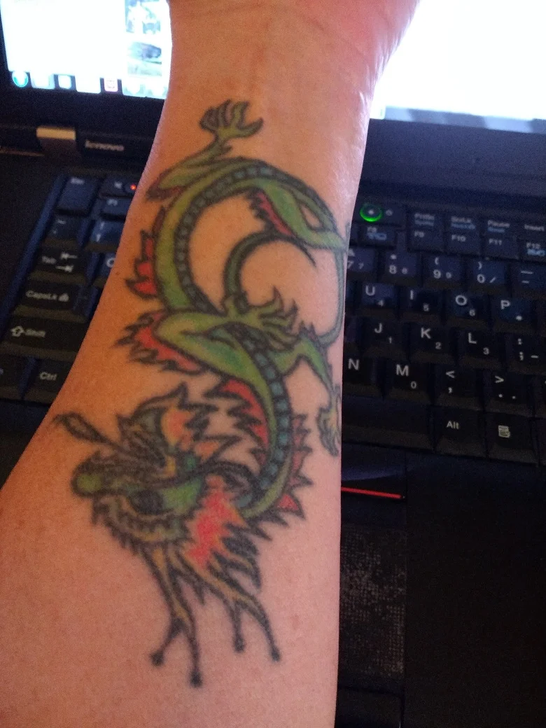 The tattoo in question. Cisco was born in 2000, Year of the Dragon.