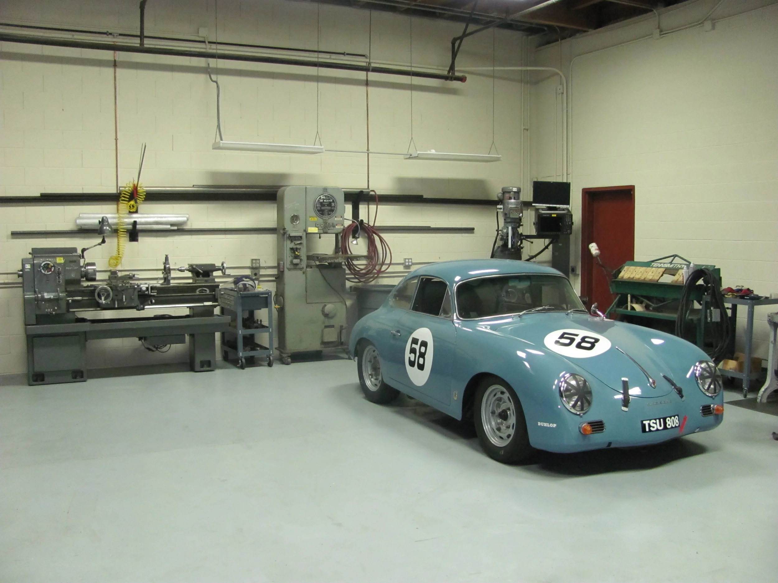 Never mind the Carrera GT, look at all that sweet fabrication equipment!