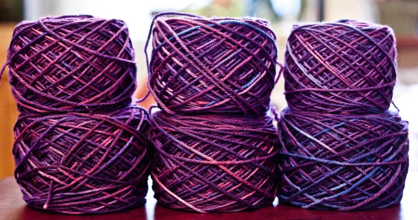 When the skeins are wound into center-pull balls, it's easy to compare how the colors will be distributed. You can see the bottom right skein is slightly more blue than the rest.