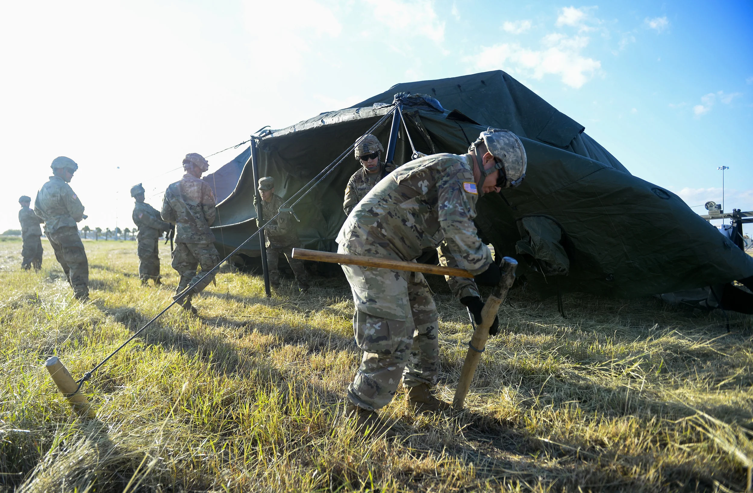 Soldiers with the 19th Engineering Battalion, 41st Clearance Company, Fort Riley, KS., build tents and set-up camp grounds near the Mexican border at Donna, TX., port of entry, in support of Operation FAITHFUL PATRIOT November 3, 2018. (U.S. Air Force photo by SrA Alexandra Minor)