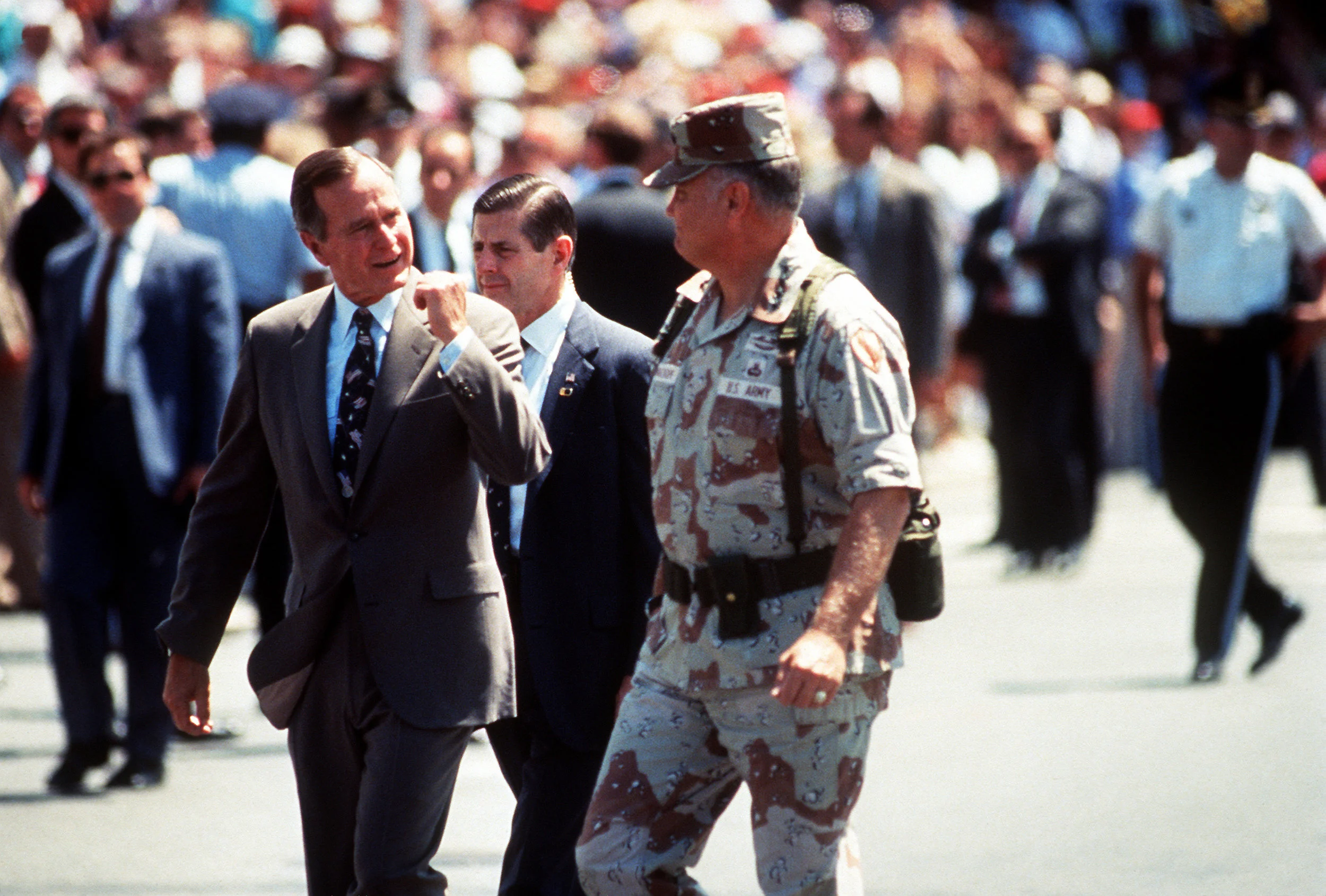 U.S. Army Gen. H. Norman Schwarzkopf (center), commander in chief, U.S. Central Command, walks to the reviewing stand with President George H.W. Bush (left) at the beginning of the National Victory Celebration parade in Washington, D.C., June 8, 1991. The day-long celebration is being held in honor of the coalition forces that liberated Kuwait during Operation Desert Storm. (Courtesy Photo)