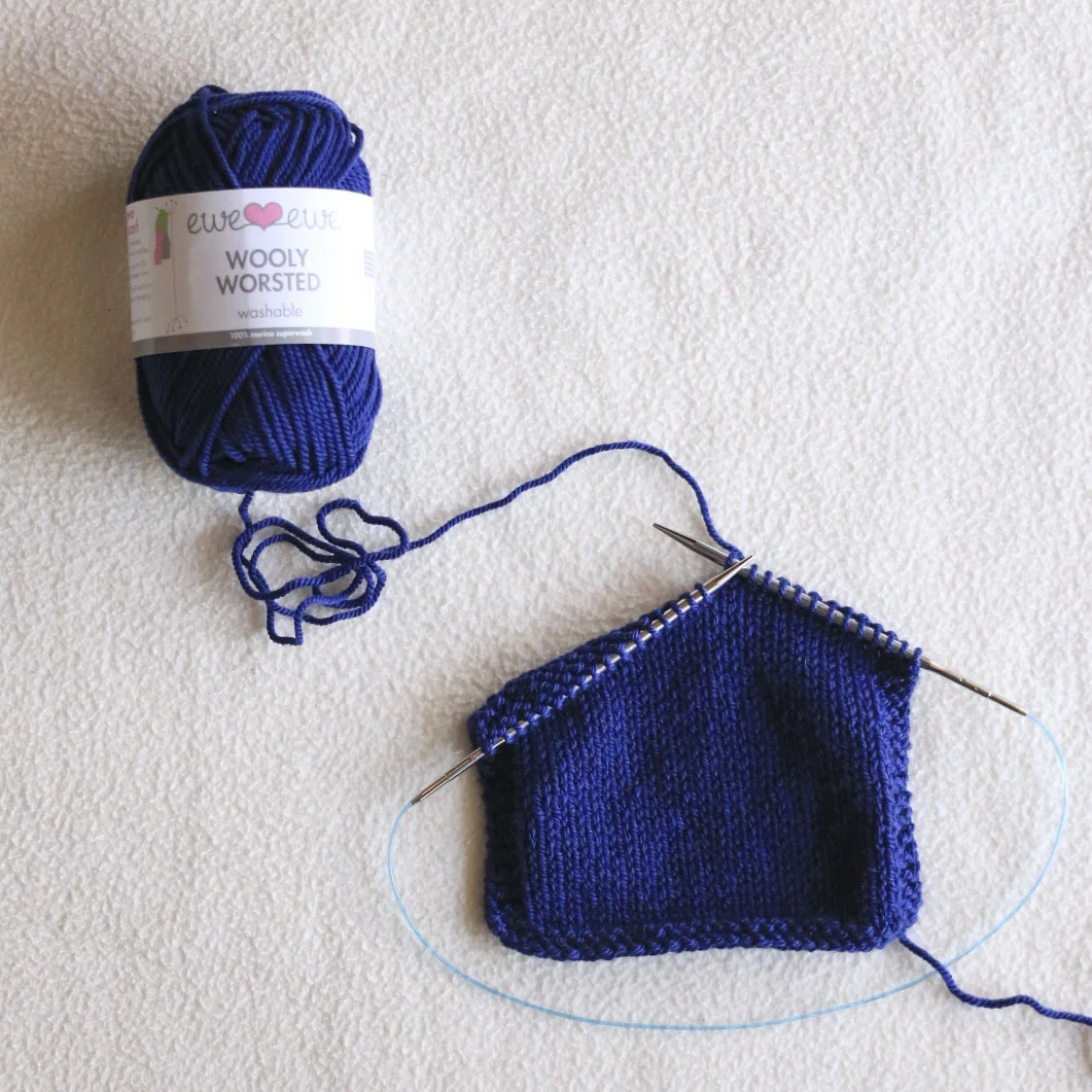 Wooly Worsted yarn in color Midnight Blue for the Foxtrot Cardigan 4 Day KAL. Shop yarn kits.