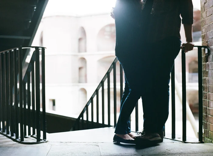 Sylvie-Gil-Engagement-Film-Photography-couple-legs-feet-staircase.jpg