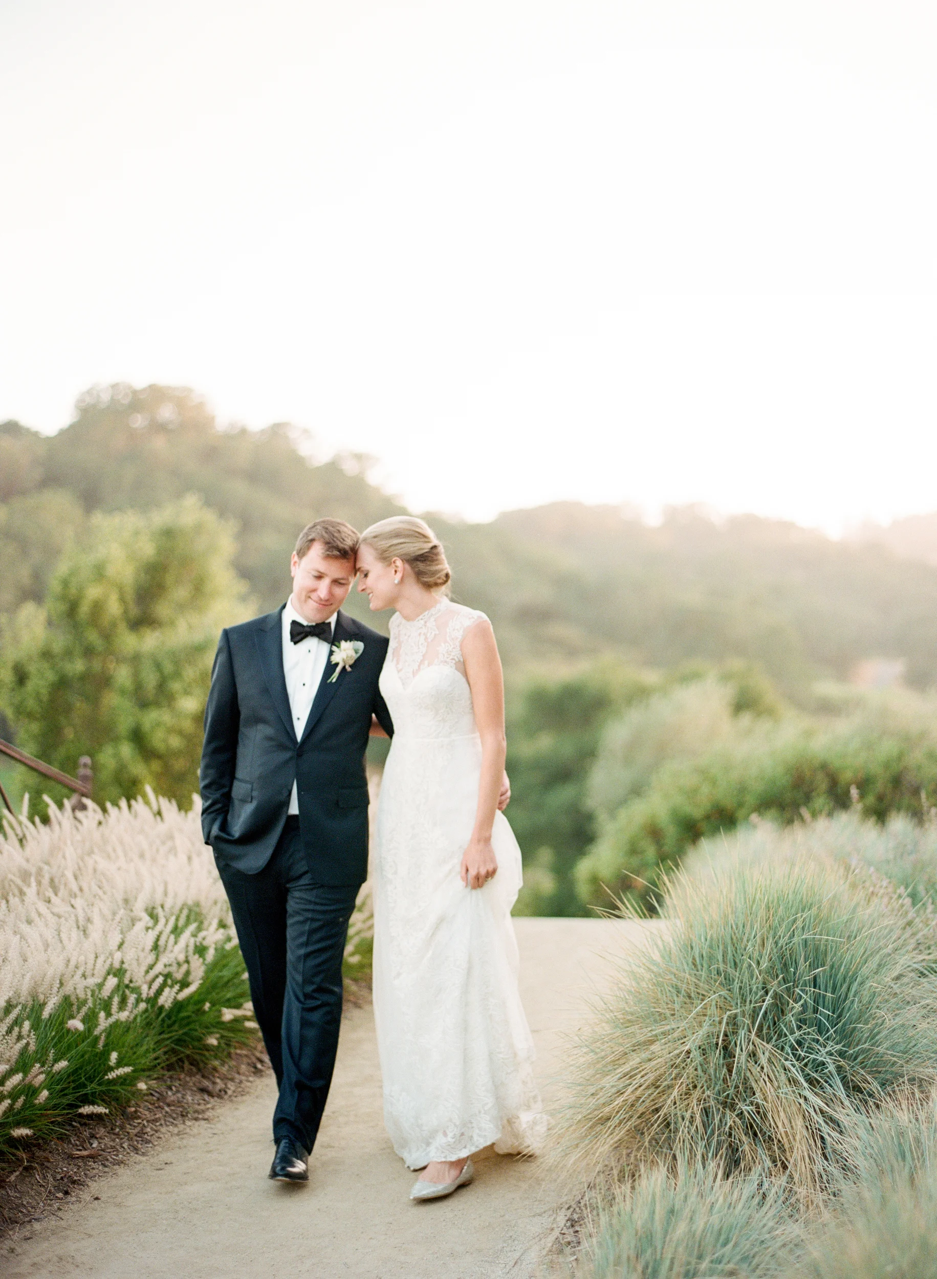 Bride and groom walk together in Calistoga Ranch during a couple session; Sylvie Gil Photography
