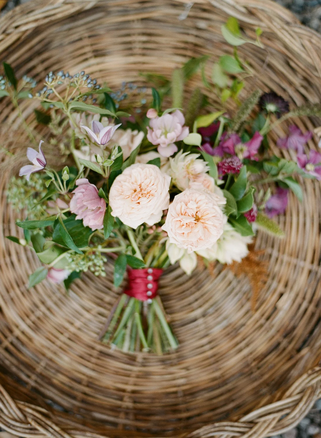 Blush and lilac blooms in a rustic bouquet; Sylvie Gil Photography