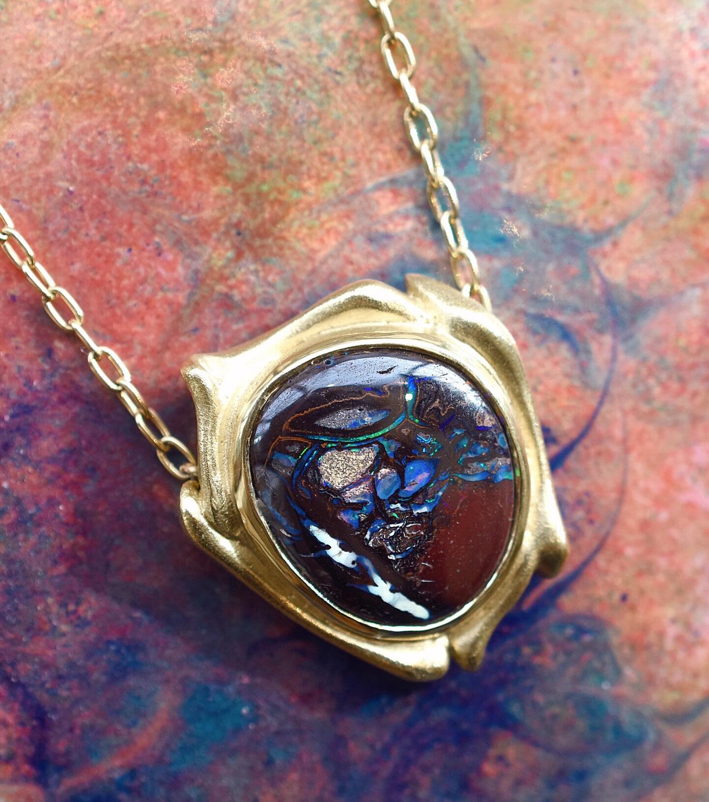 a 5ct boulder opal set in an 18k yellow gold freeform pendant ✨💫