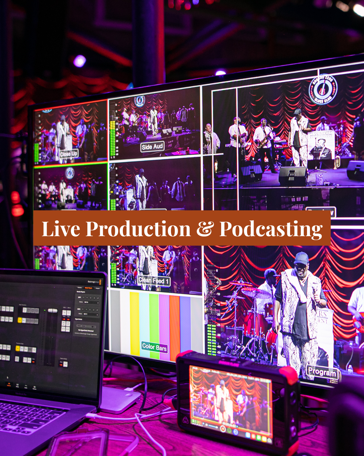 A control room with multiple monitors displaying a live music performance on stage with performers and a red curtain backdrop, with an overlay text saying 'Live Production & Podcasting'.