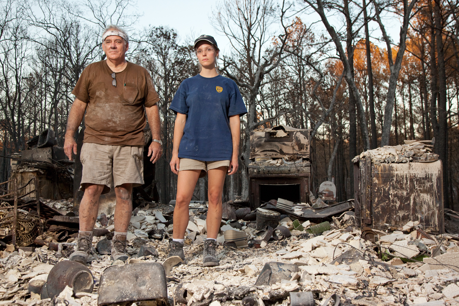   Father and Daughter, Paul and Jess Phillips standing in what used to be their kitchen.
