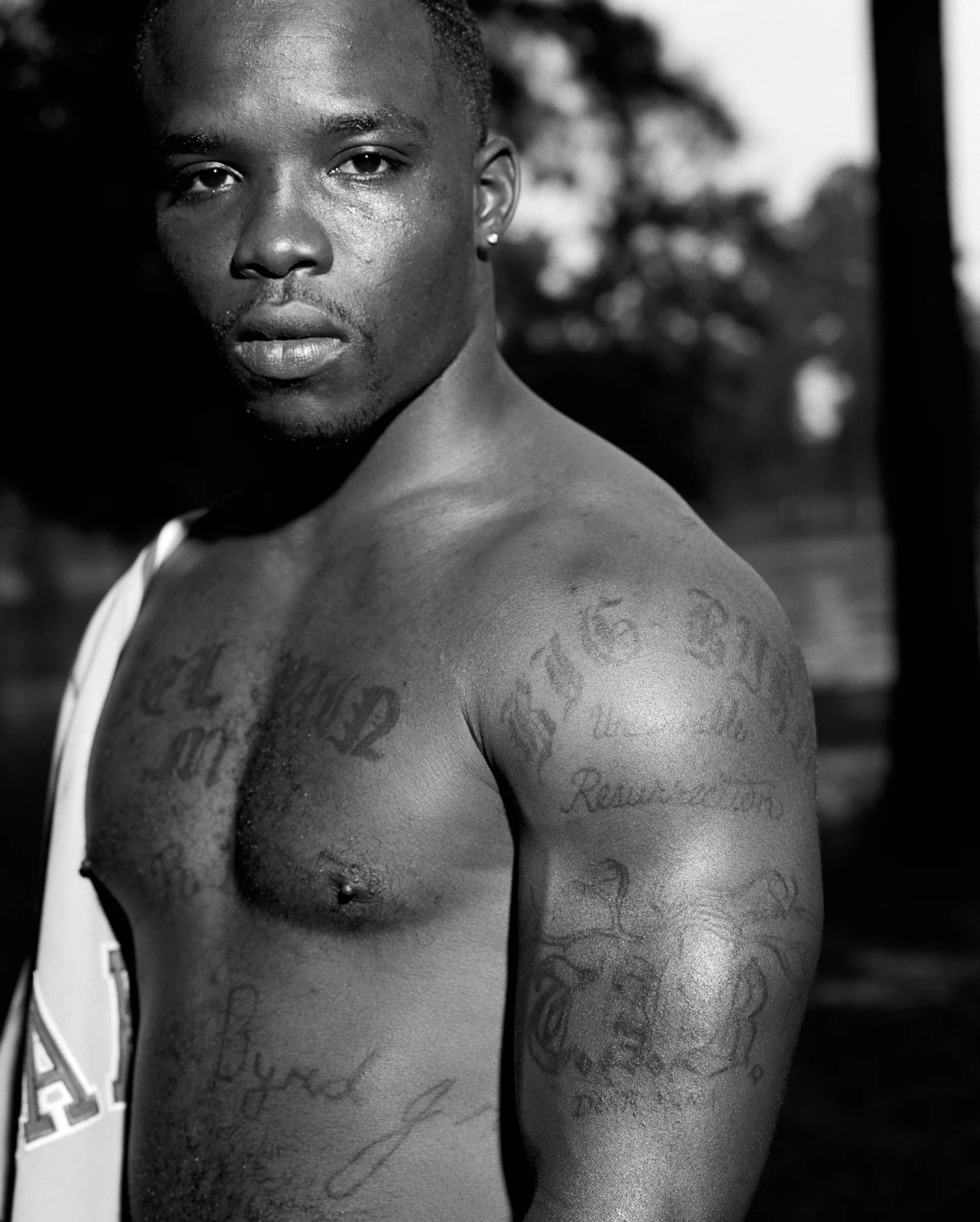 In the years since his father’s murder, Ross Byrd has become an ardent anti-death penalty activist. His tattoos memorialize his father.