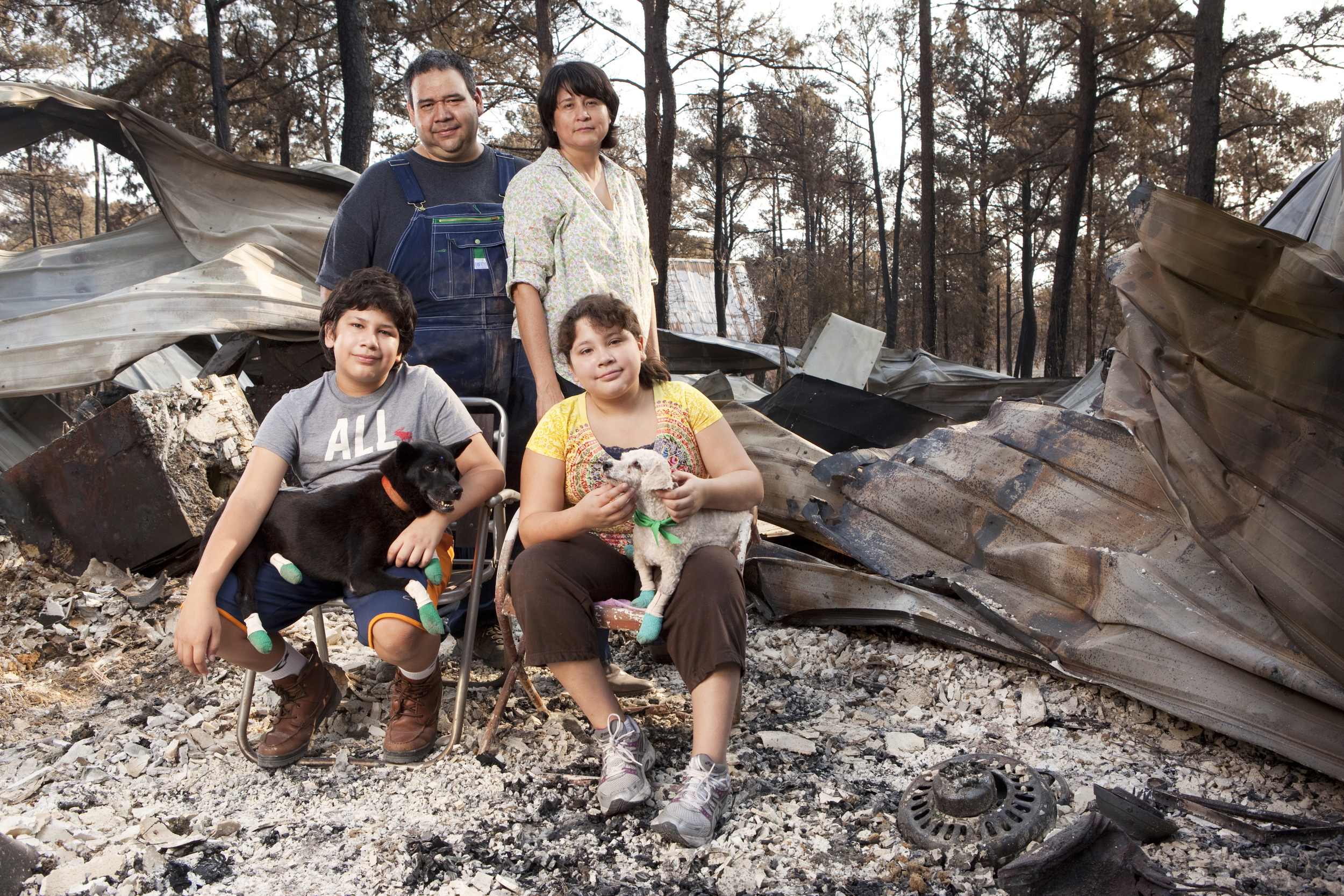 Sandra and David Trevino and their children Rafael and Victoria assumed that all of their pets had died when their house burned. Five days after the fire came through, the Trevinos were allowed to return and see the devastation, and two of their dogs, Chata and Pooh, came running towards them. The dogs survived for an entire week on their own. They suffered from dehydration and had some cuts and burns on their feet. 