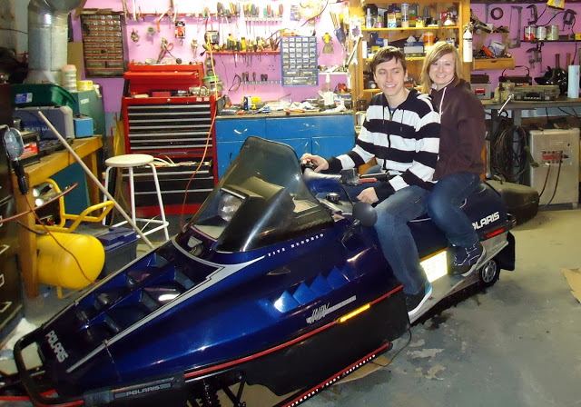 Checking out the snowmobile.