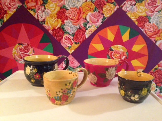 Mugs we bought from Don Swanson. A new quilt in the background that I am working on called "Compass Roses".