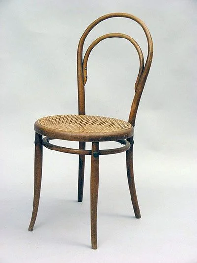 An original Chair No. 14 with wicker seat.