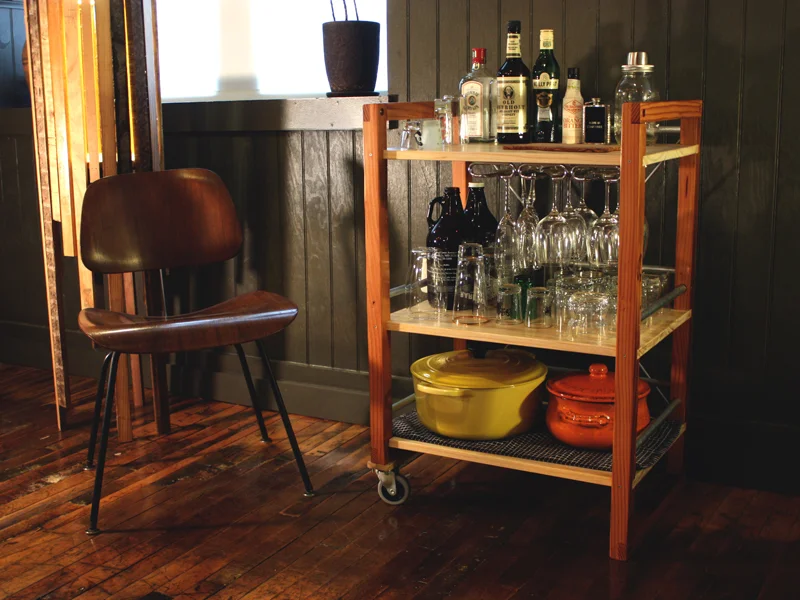 Liquor on top, glasses in the middle, pots on the bottom.