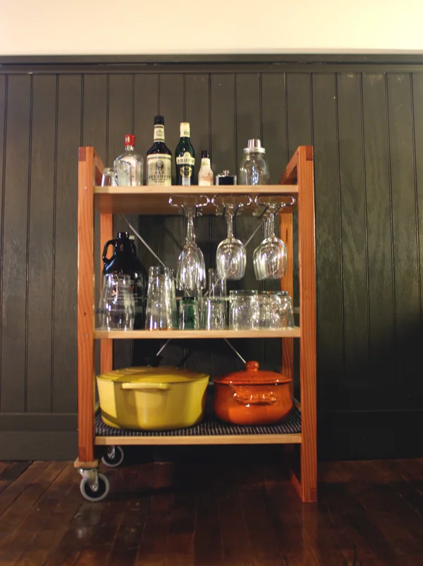 The wineglass holder is available off-the-shelf at Home Depot.