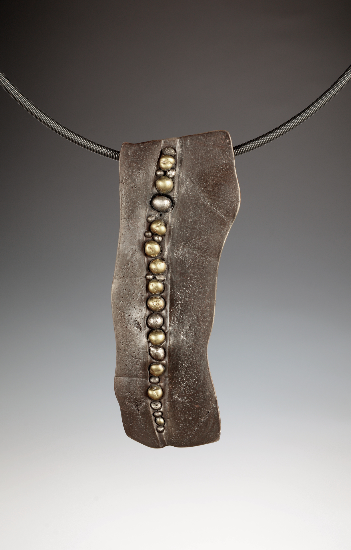 Shards & Pebbles Nature-inspired Necklace. Sterling silver “shards” with 22k gold “pebbles.”