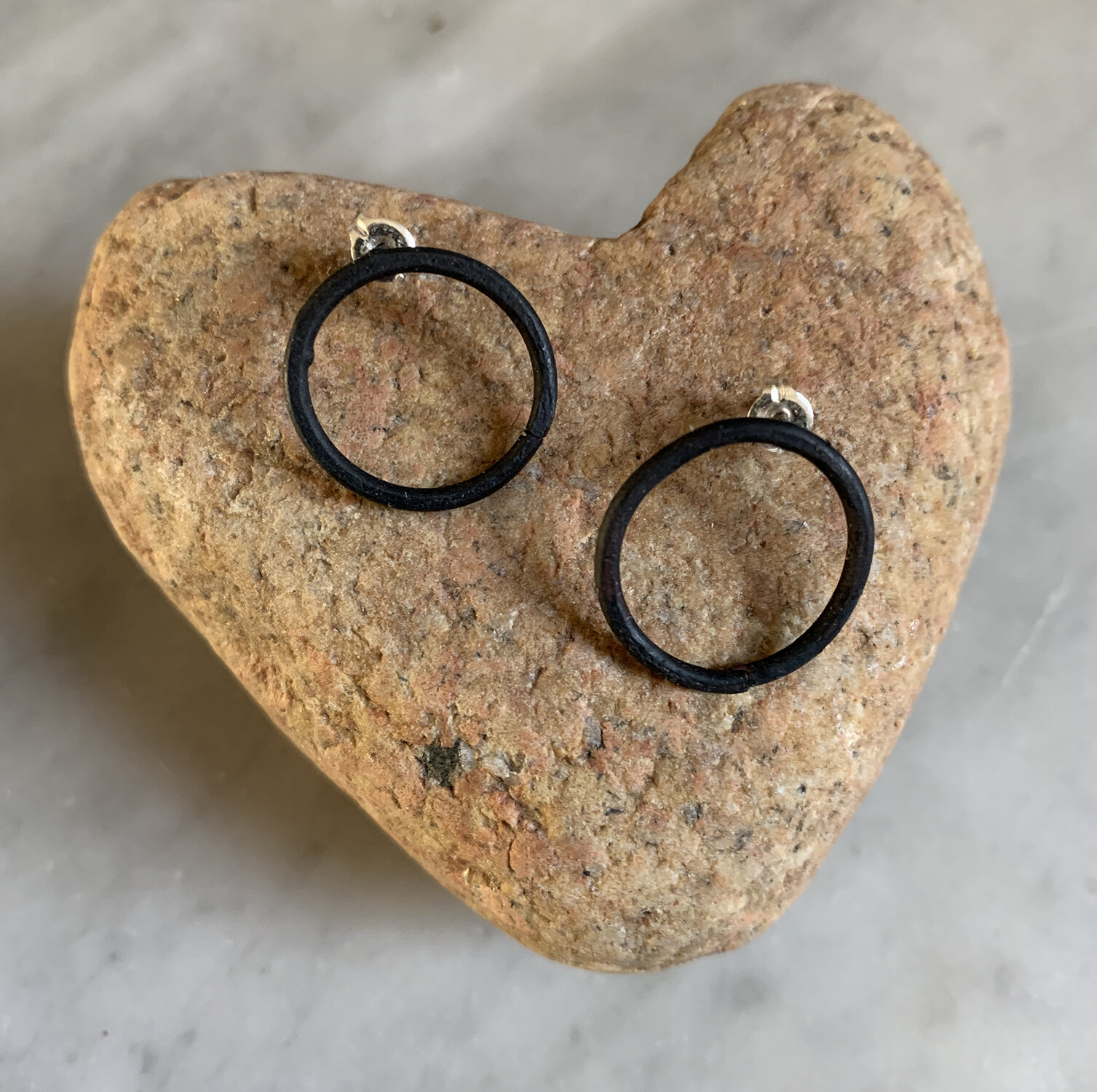 Mild steel earrings with sterling silver posts.