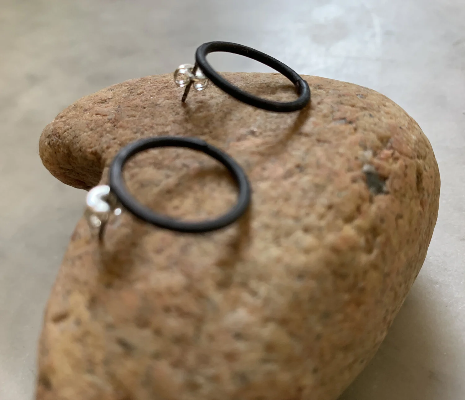 Mild steel earrings with sterling silver posts.