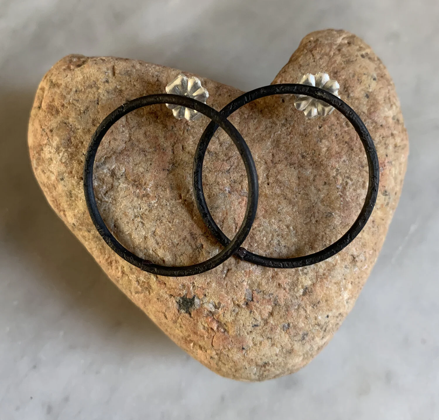 Mild steel earrings with sterling silver posts.