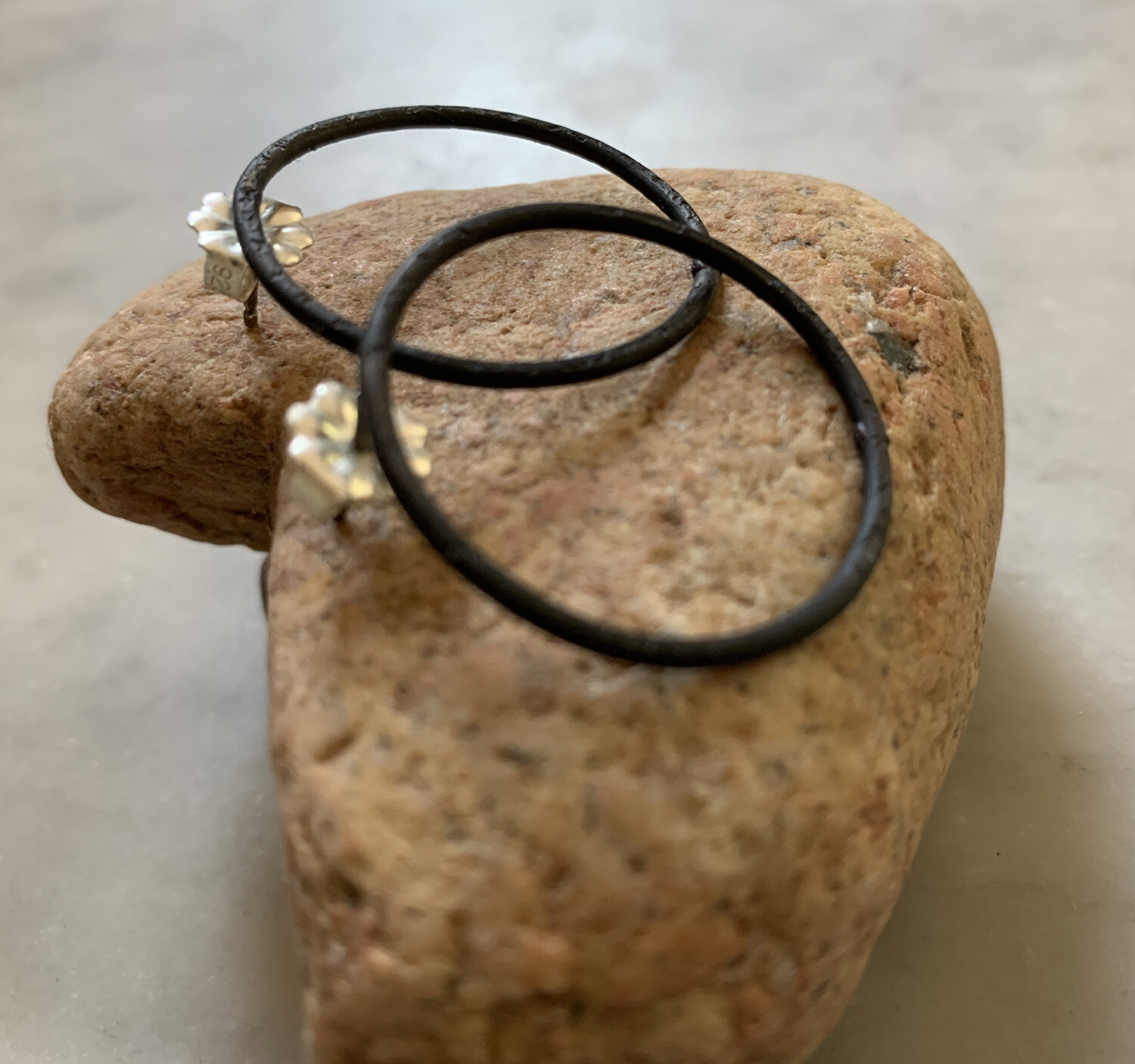 Mild steel earrings with sterling silver posts.