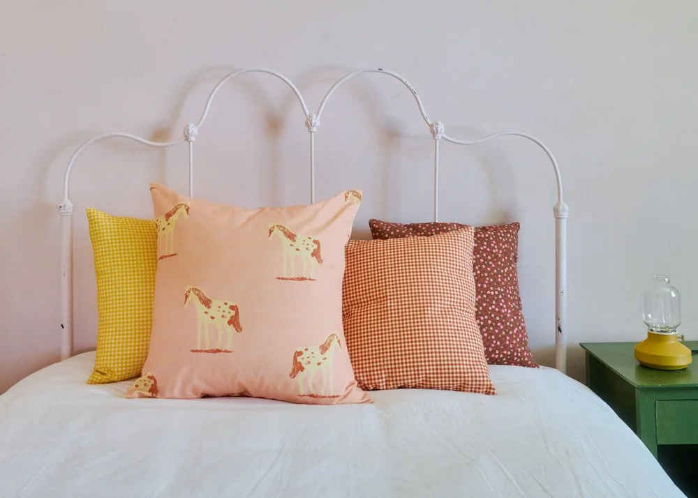 PINKPONIES-PILLOWS-ON BED.jpg