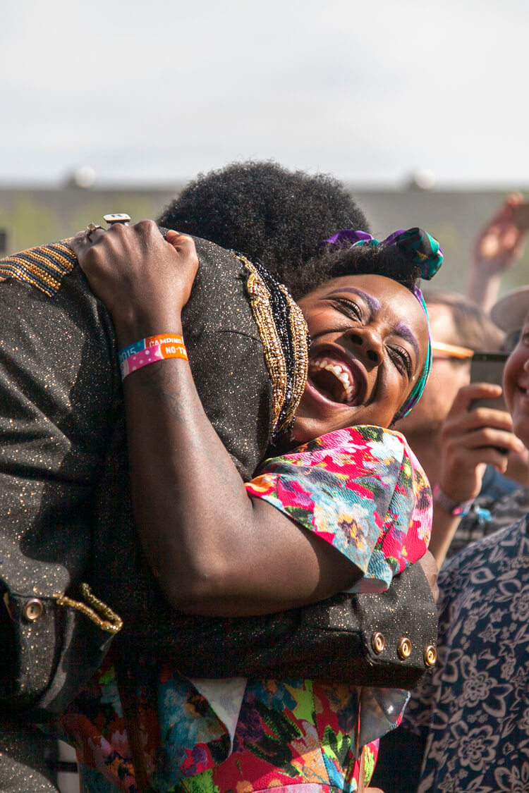 Charles Bradley hugging a fan