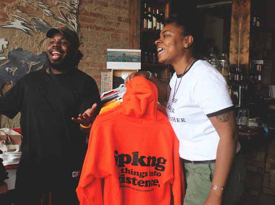 Ron owner ok SPKNG getting in a good laugh with Queen City Noire curator Erikka Shop with Ron online www.spkngintongues.com