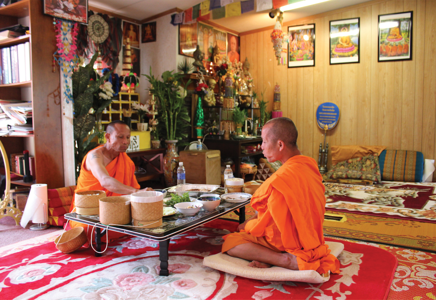 The monks of Morganton accept home-cooked meals four times a week in place of walking the streets at dawn for their daily alms. Somchit Sengdavone (left) and Somphet Souriyavongsa (right).