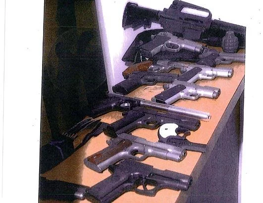 Guns secreted in a wall at Whitey's Santa Monica lair. Also recovered was $822,000 in cash. 