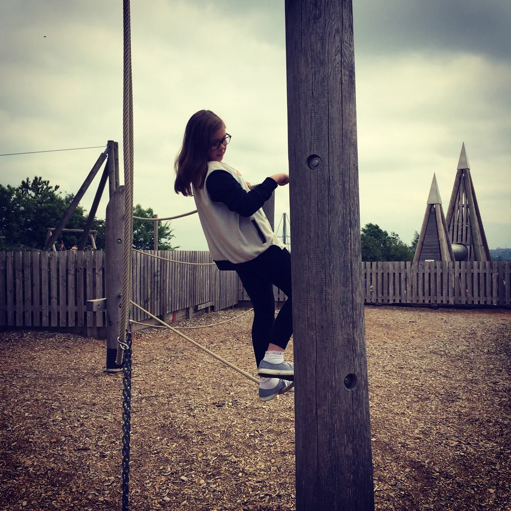 Amber enjoying climbing in the more challenging older kids play area at Cannon Hall Farm.