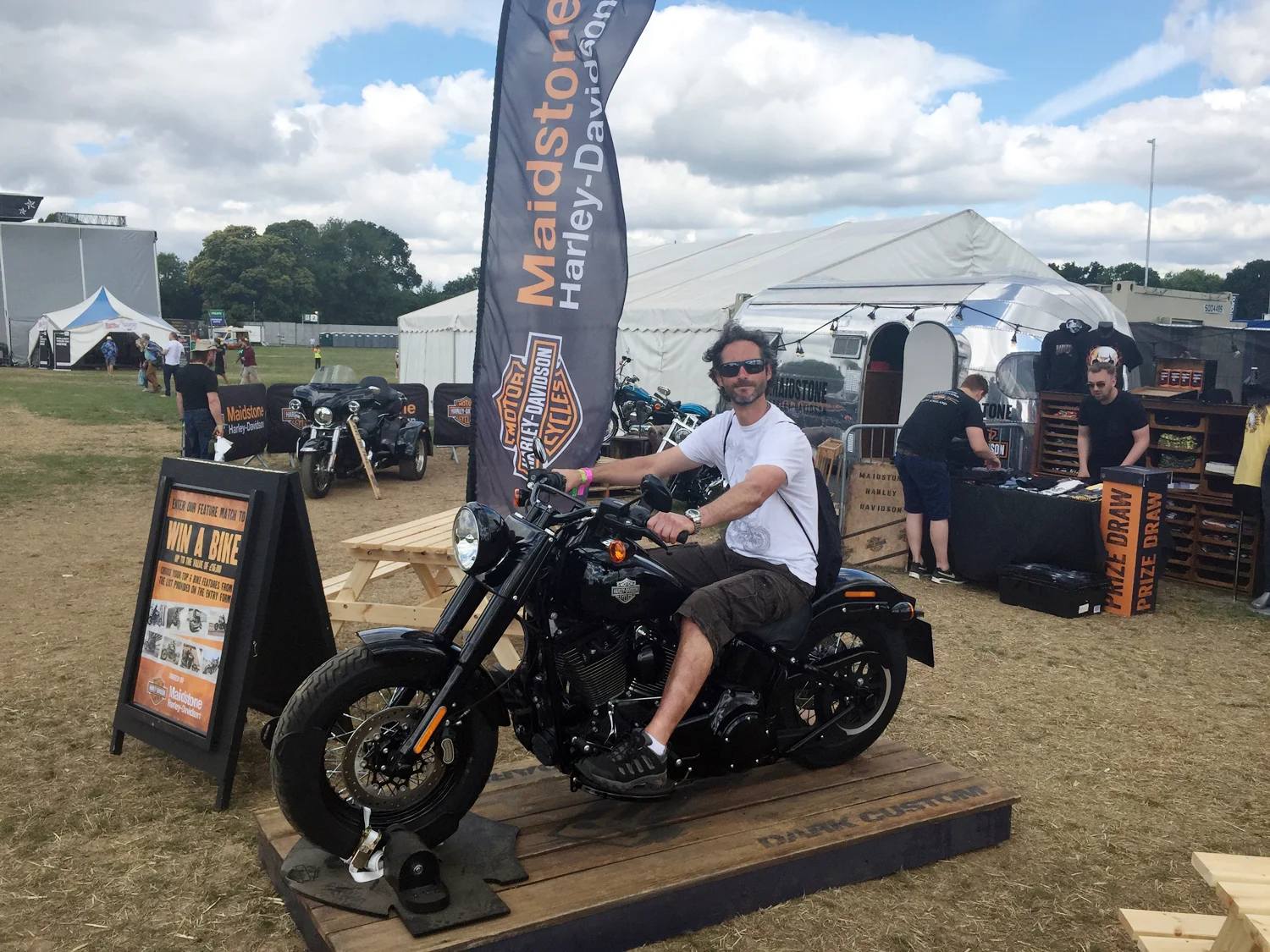 Andy sat on a Harley at Ramblin' Man Fair