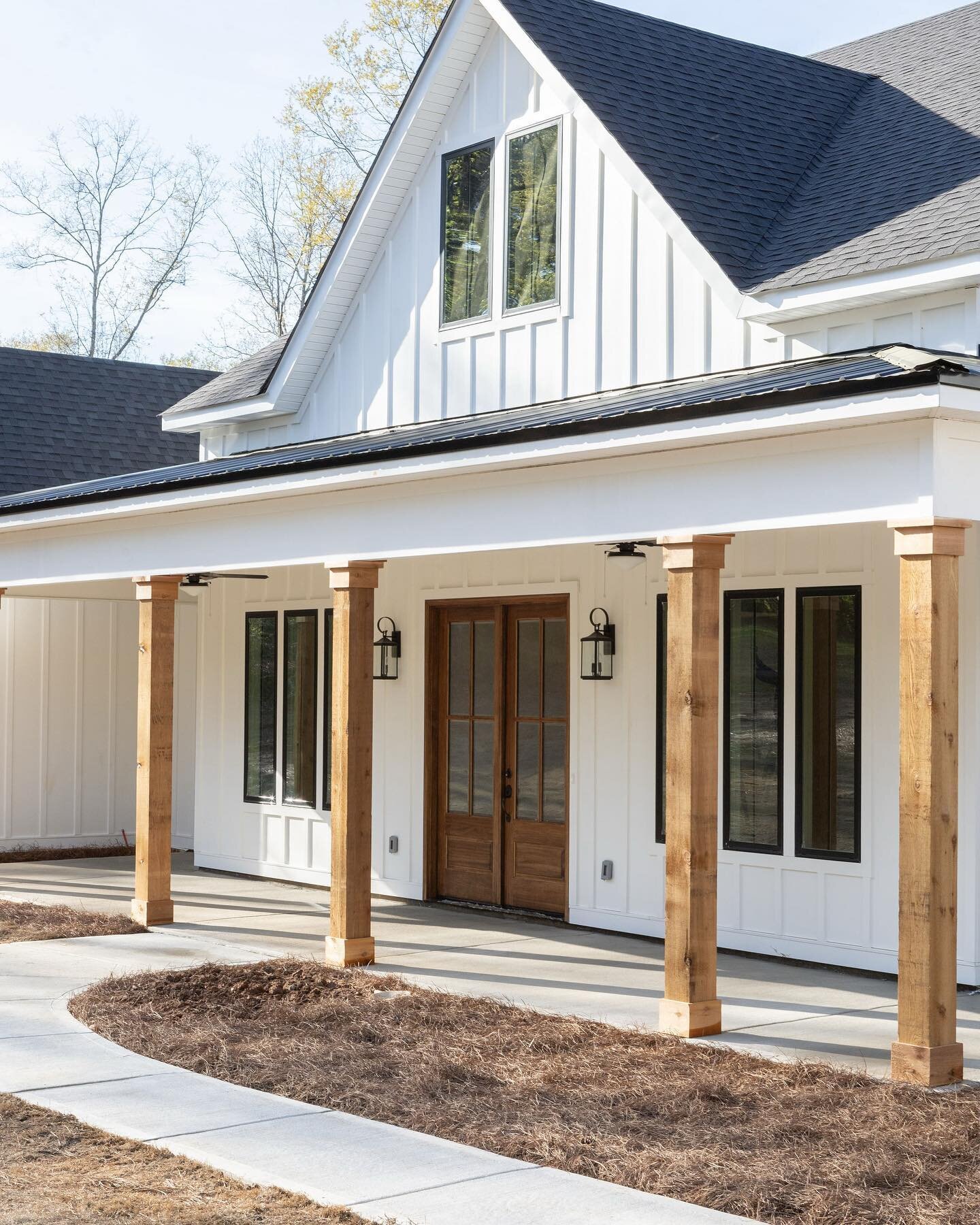 One of our latest farmhouse exteriors featuring cedar columns and gooseneck lighting. What do you love most? 🗝 #kellywatsondesigner #ryanwatsonbuilder 
.
.
.
.
.
.
#farmhouse #farmhousestyle #farmhouselove #farmhouseexterior #farmhousedesign #farmho