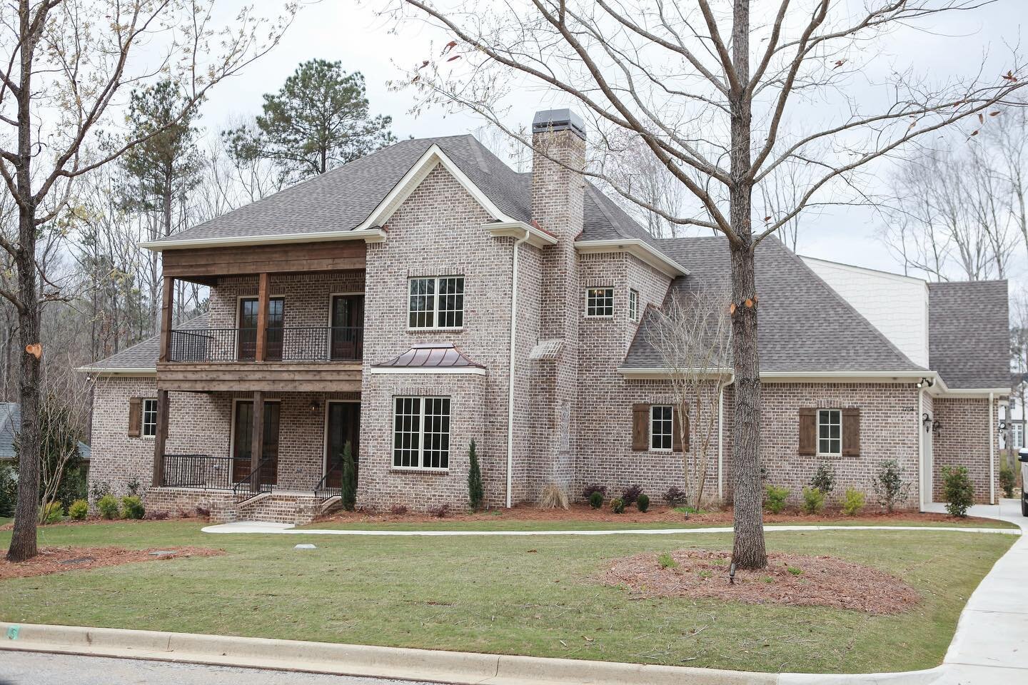 Custom home in East Lake Estates featuring brick pavers, gas lanterns, wrought iron handrails, and cedar accents. #kellywatsondesigner #ryanwatsonbuilder #landmarkproperties
.
.
.
.
.
.
.
.
#customlandmarkproperties #homeexterior #homeexteriors #exte