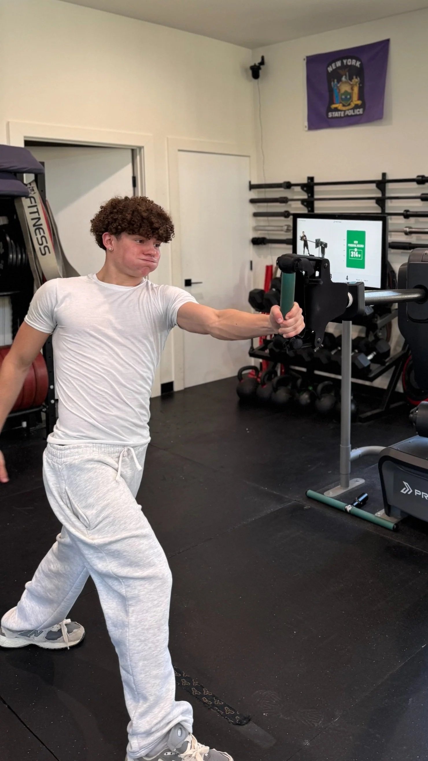 Athlete performing a barbell strength training exercise at Kings of Fitness Sports Performance in LaGrange, New York.