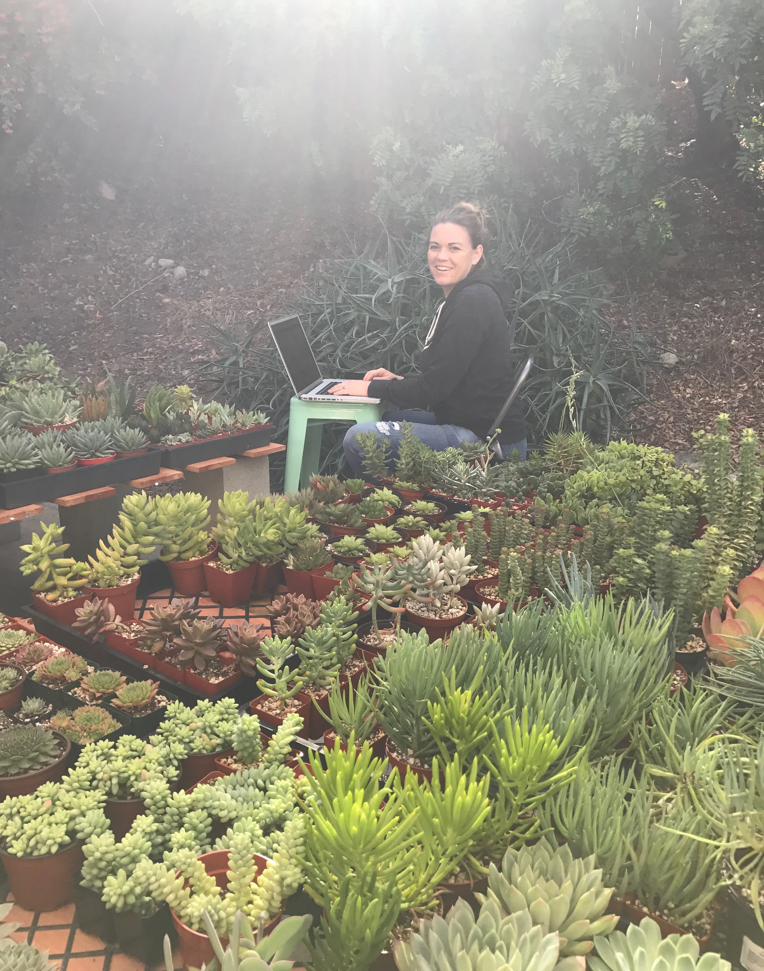 Krista taking inventory at our home nursery.