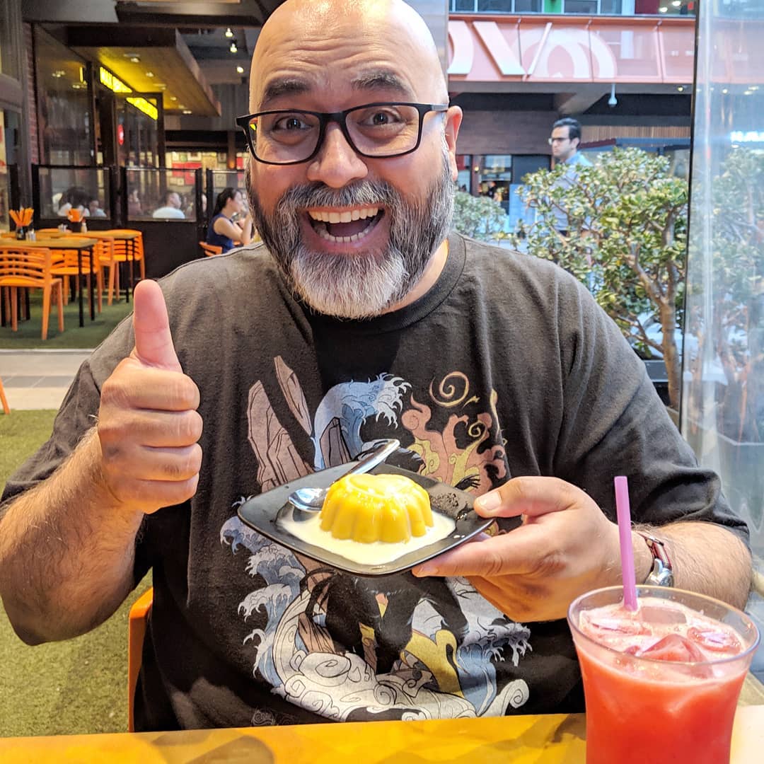 @ameelkhan is unrepentant in his consumption of mango pudding. #nom #dessert #mangopudding ( Source )