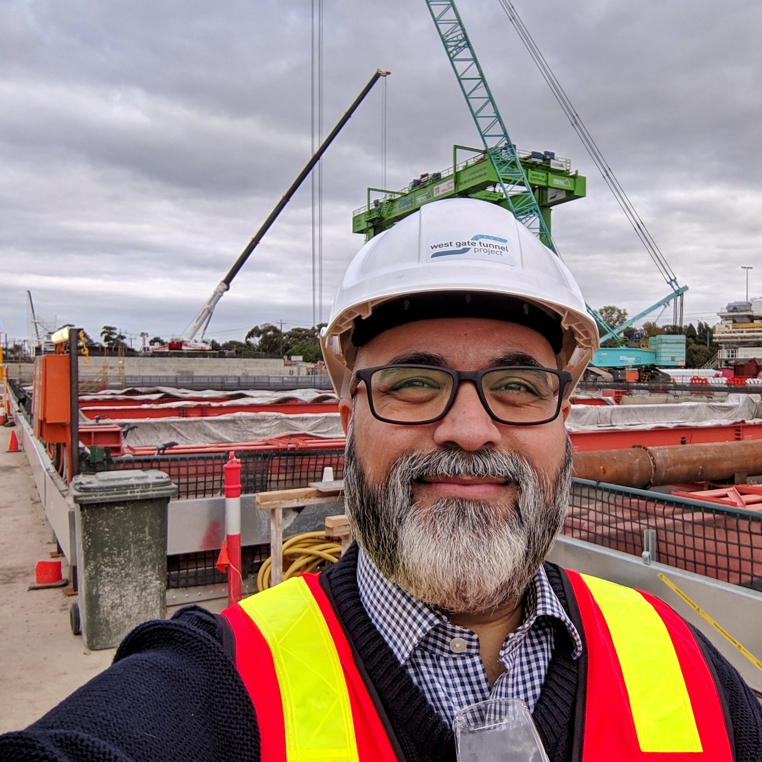Wearing boots, a hard hat, and high visibility vest while touring the West Gate Tunnel Project northern portal (which is across the street from Yarraville Gardens ).
