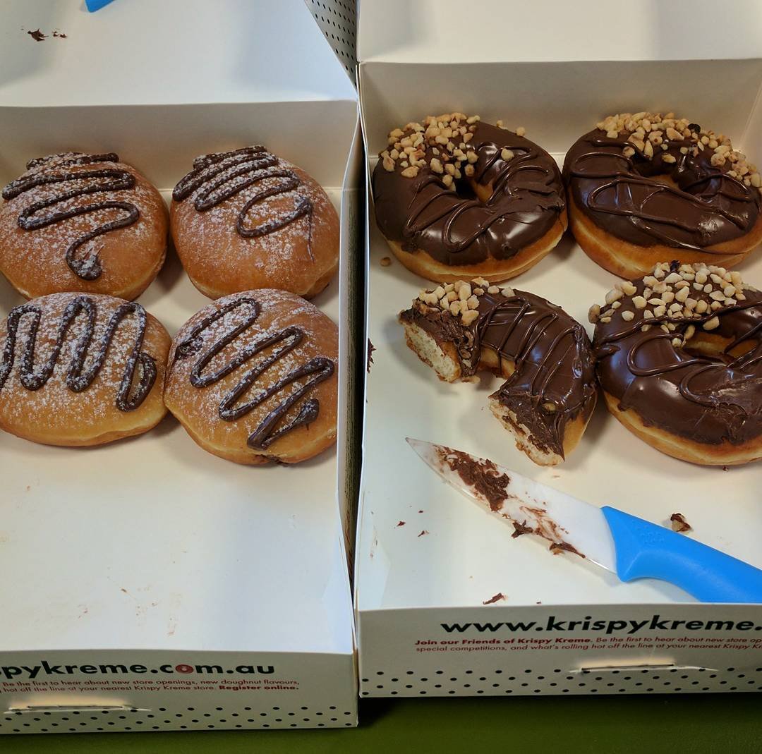  Working our way through the new @Nutella filled and dipped @KrispyKremeAustralia doughnuts at work this morning :) 