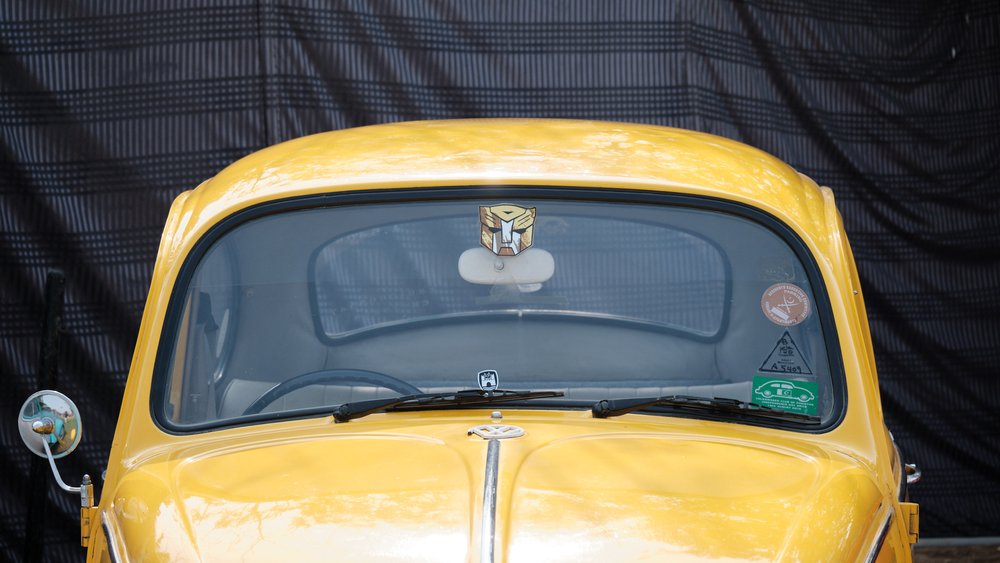 Bumblebee Transformer sticker on a yellow VW Beetle at Antique Car Show Karachi 2024