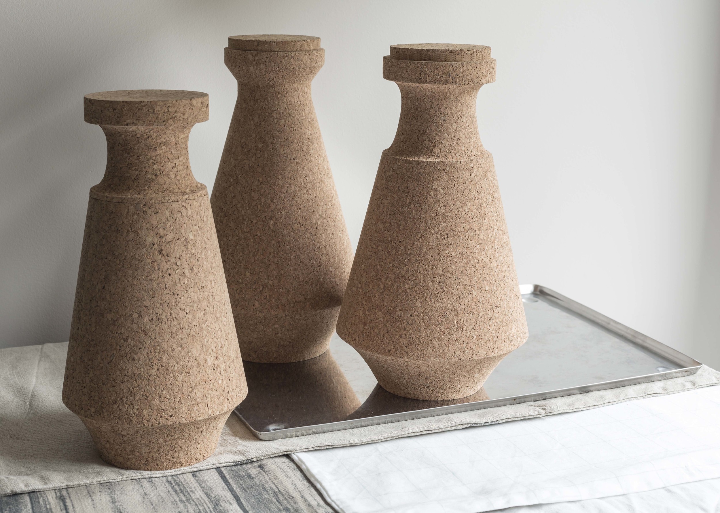 The design is inspired by taro, traditional cork container with lid, Portuguese shepherd used to carry and preserve food. The idea is to use cork’s sustainable, renewable and thermally quality to create a low tech, durable beverage server, which will use a lot less energy and low carbon to produce than conventional thermal flasks. It has vacuum flask’s performance with a more pleasing appearance and greater life spans than common double walled glass flasks.